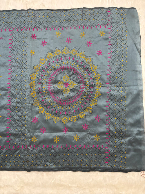 Embroidered fabric with floral patterns on a white background