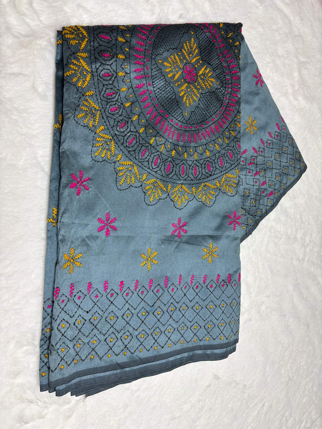 Embroidered fabric with floral patterns on a white background
