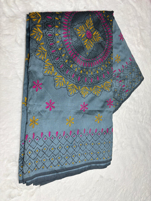 Embroidered fabric with floral patterns on a white background