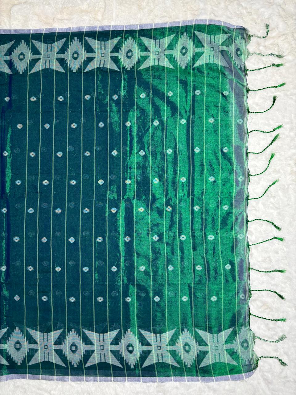 Green fabric with white patterns on a white background