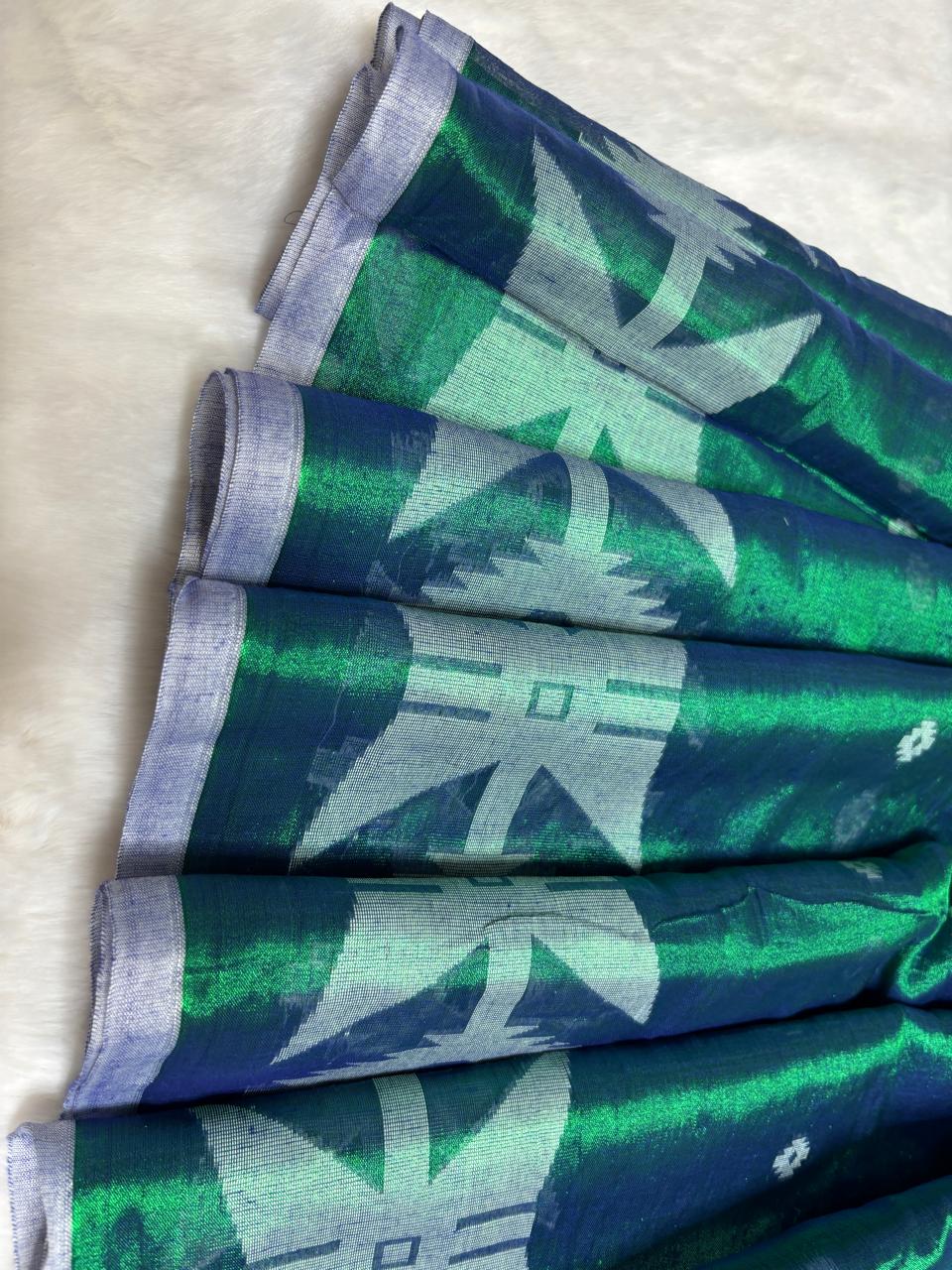 Green fabric with white patterns on a white background