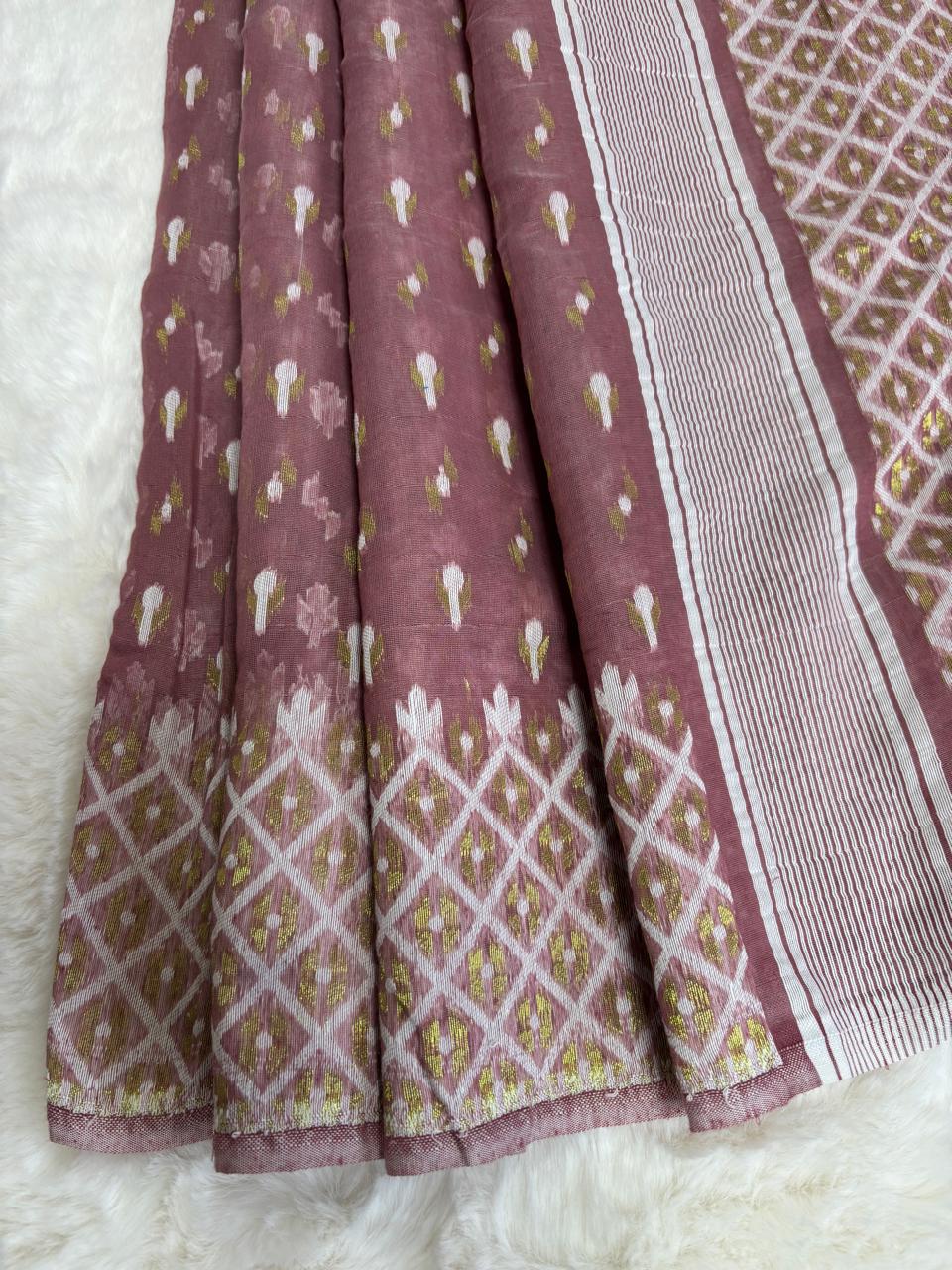 Folded fabric with geometric patterns on a white background