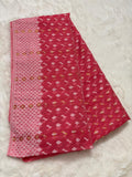Pink fabric with a pattern on a light gray background