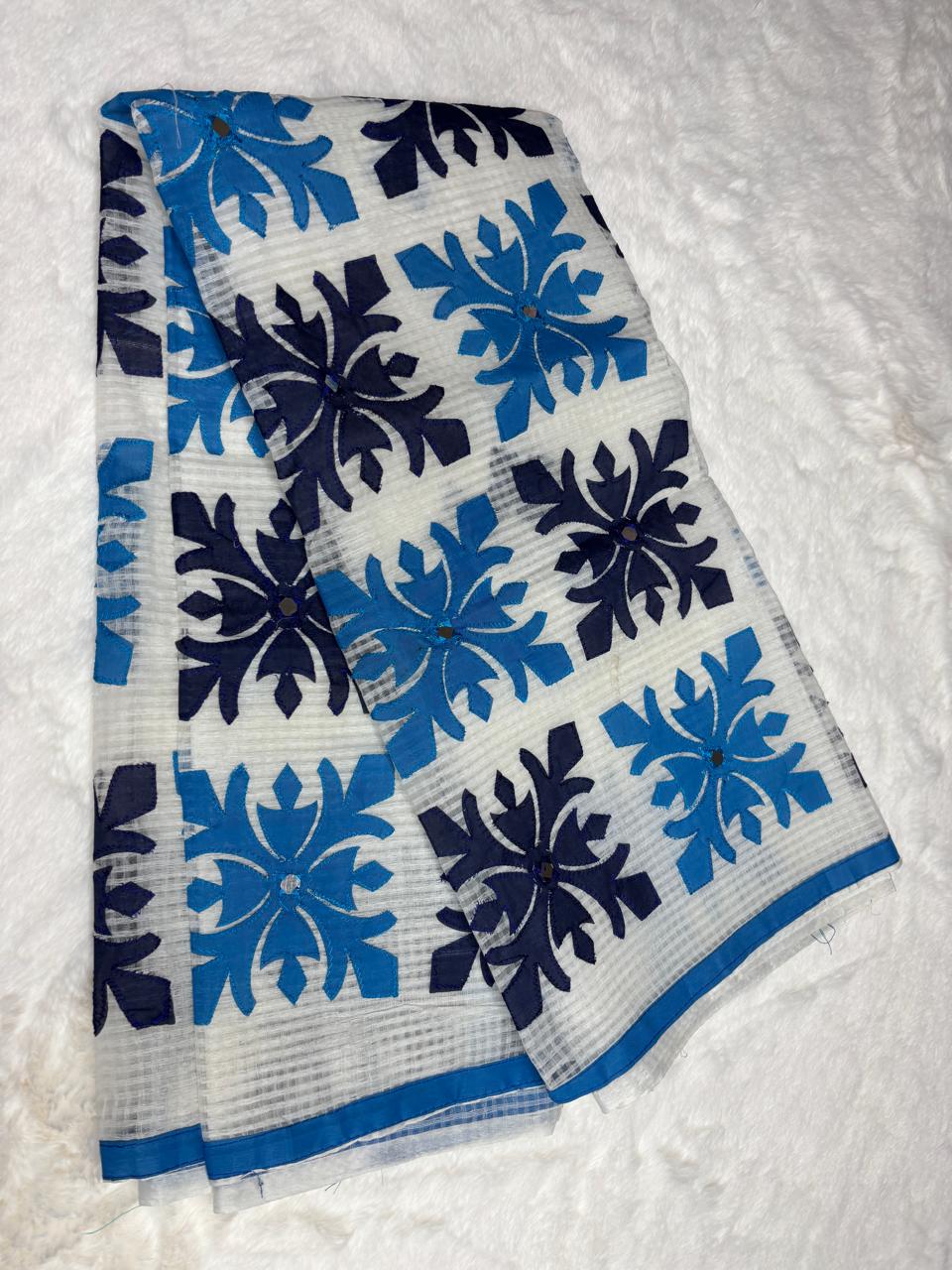 Blue and black floral patterned fabric on a white background