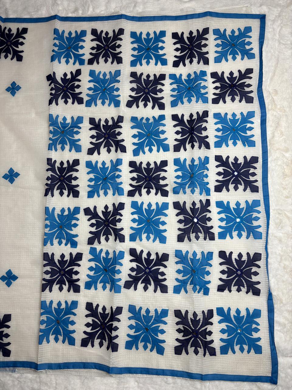 blue and black geometric pattern on a white background
