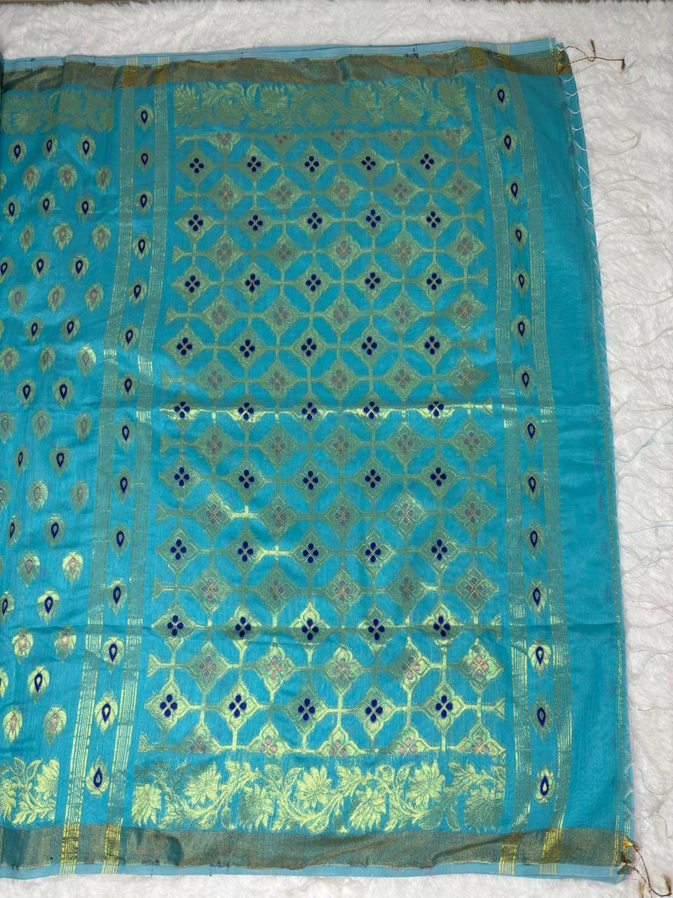 Blue fabric with intricate patterns on a white background