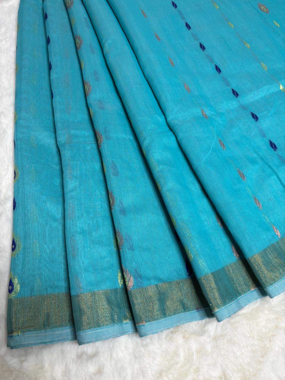 Turquoise fabric with a subtle pattern on a white background