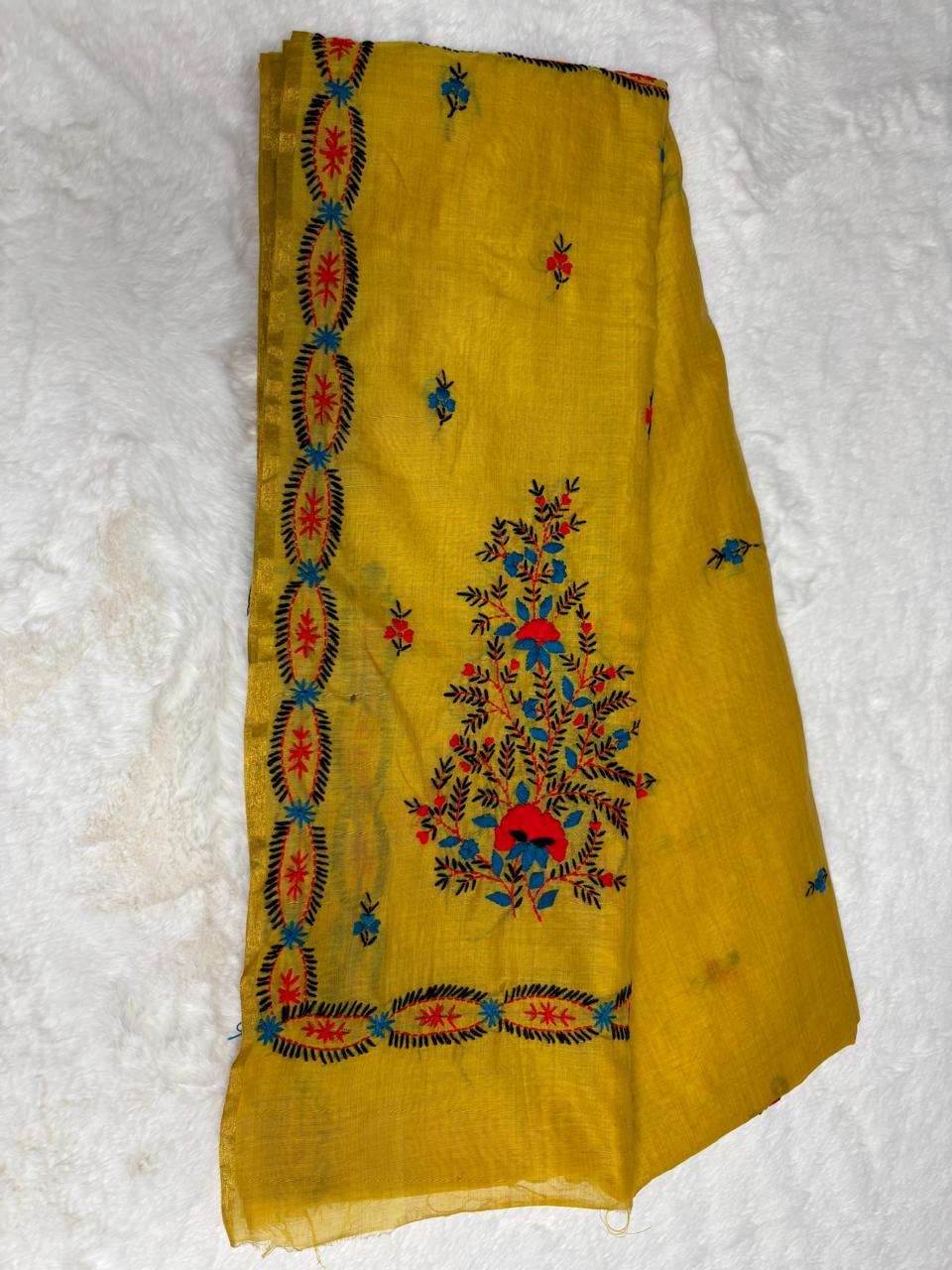 Yellow fabric with floral embroidery on a white background